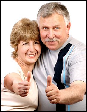 Thumbs up happy couple for repaired fireplace